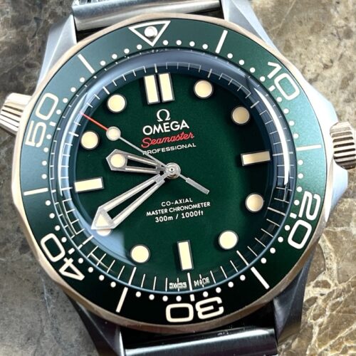 Omega Seamaster Diver 300M Automatic 42mm Green Dial Titanium Bronze Gold Mesh Bracelet Box Papers Cards 210.90.42.20.10.001 Year 2025